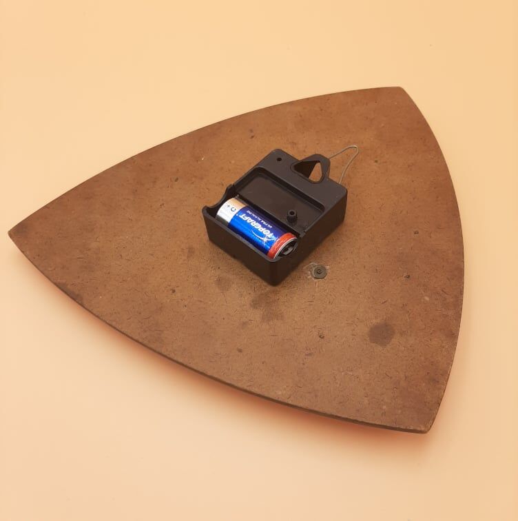 Triangular clock in red formica