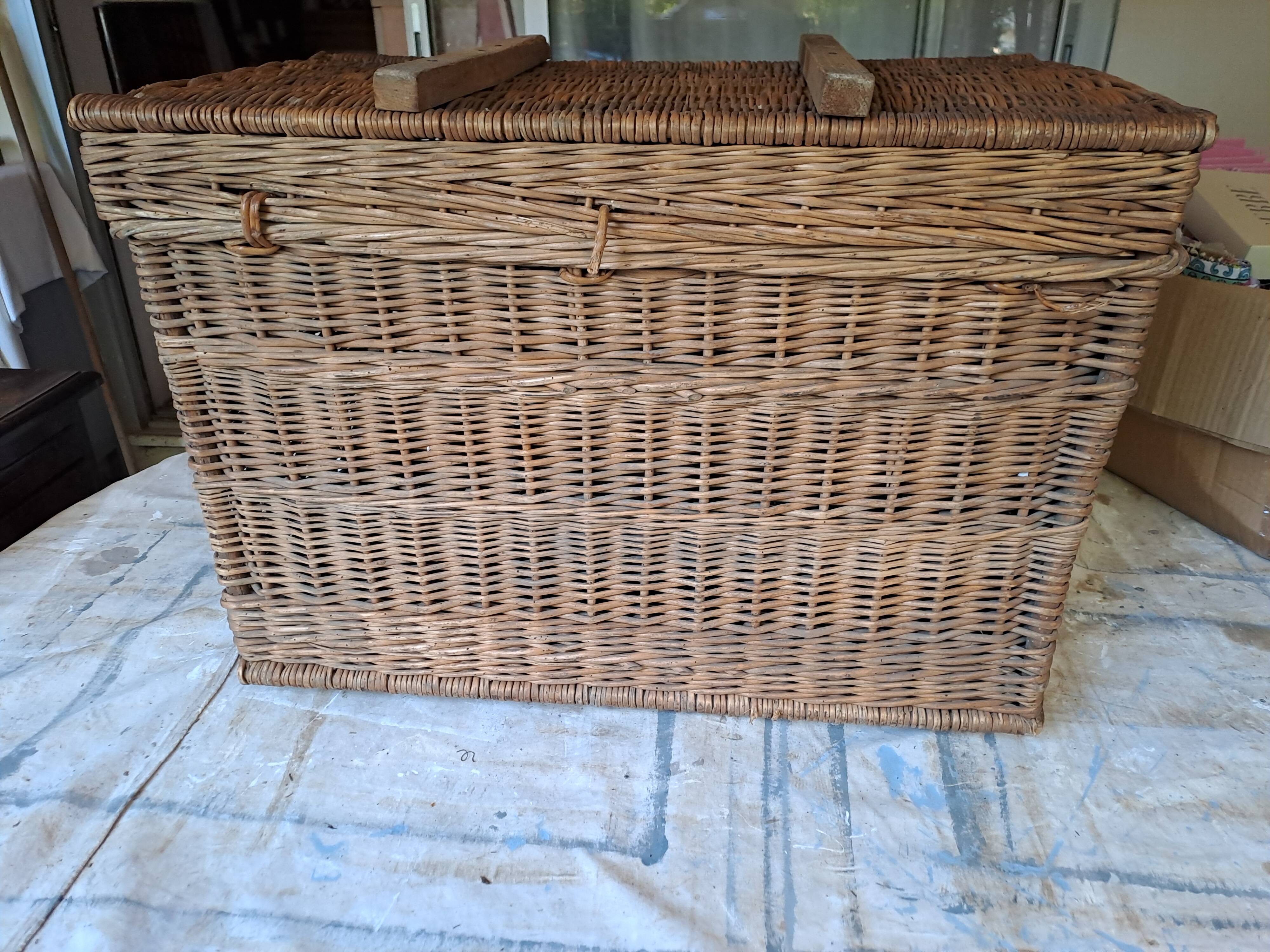 Wicker travel trunk XIX with metal clasps and handles.