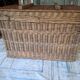 Wicker travel trunk XIX with metal clasps and handles.