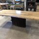 Chestnut and walnut solid table and benches with a central leg.
