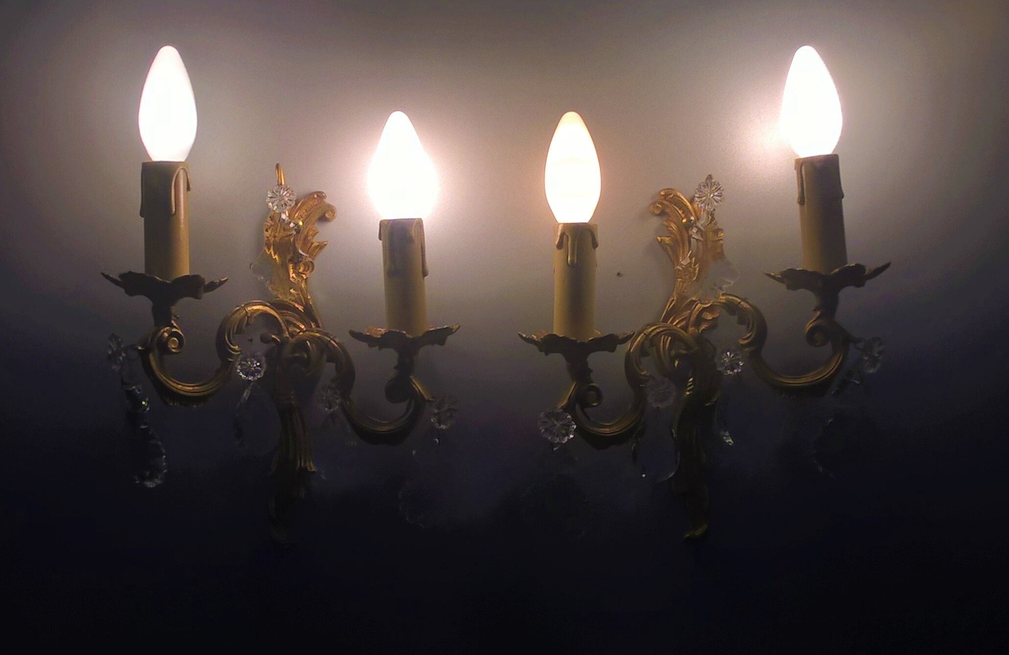 Pair of asymmetrical appliques, gilded bronze and crystal tassels, Louis XV style