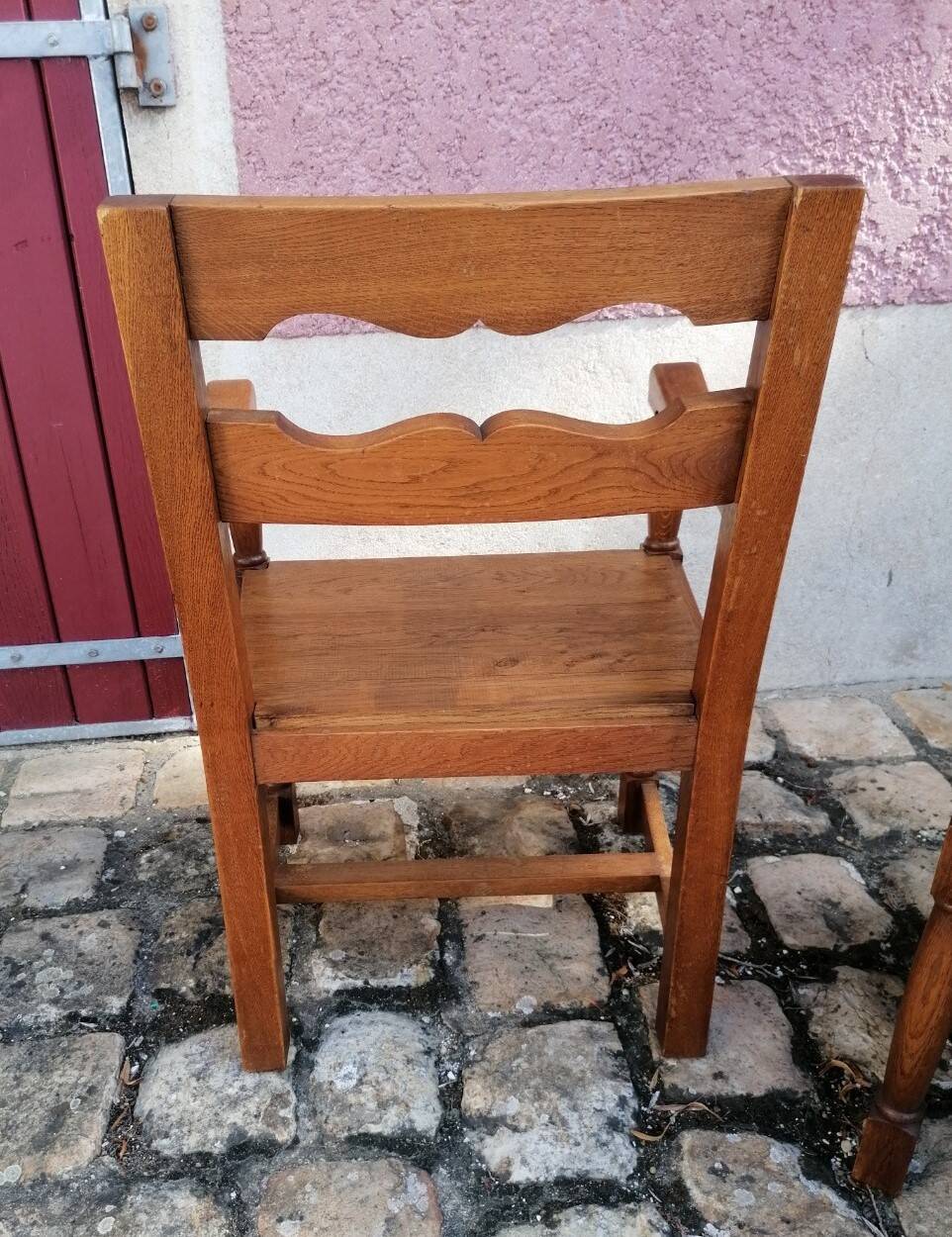 Pair of vintage oak armchairs with geometric design.