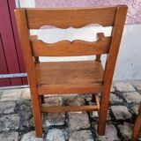 Pair of vintage oak armchairs with geometric design.