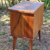 Wooden bedside table with compass feet