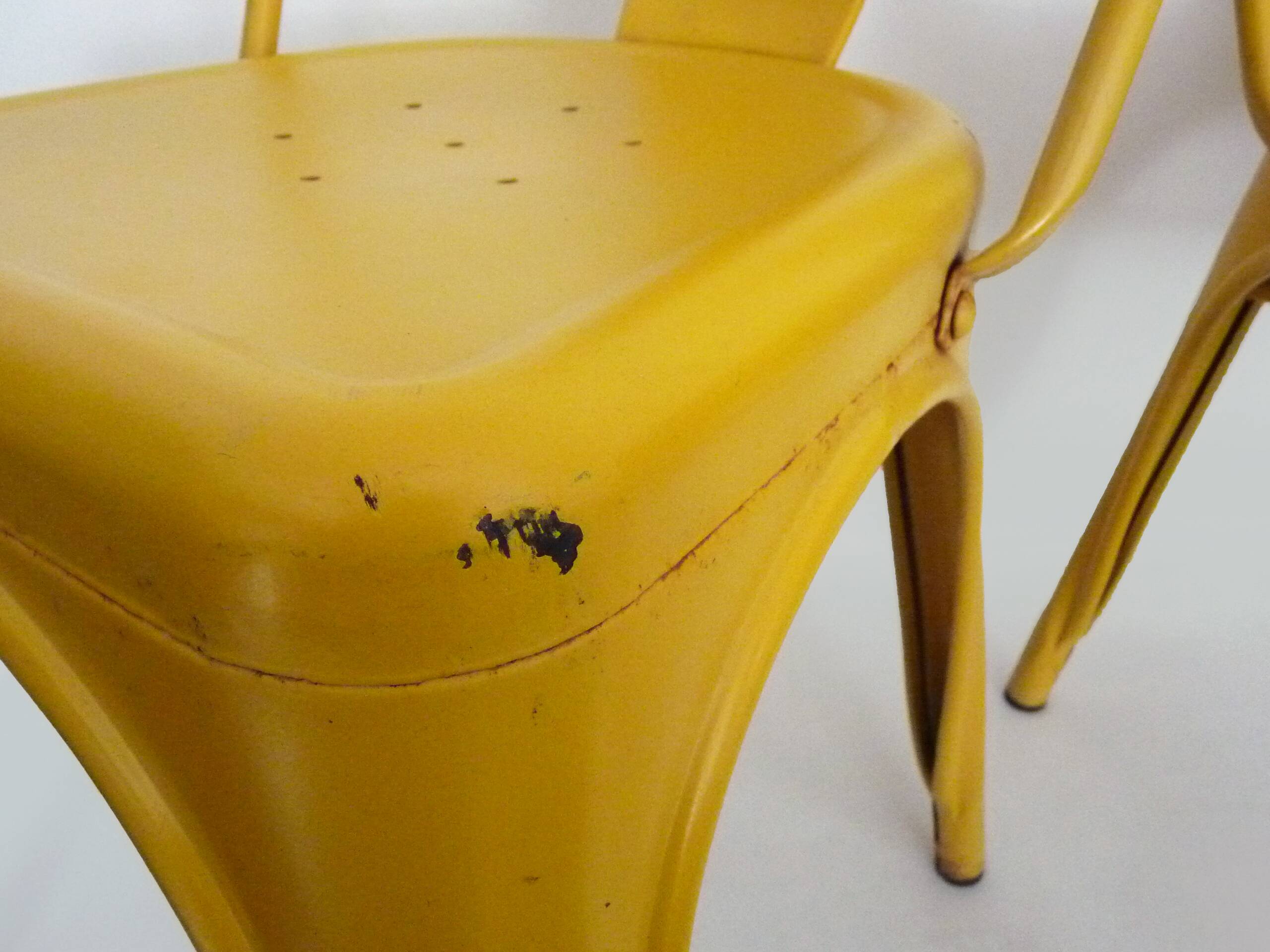 Pair of Tolix Chairs in yellow metal by Xavier Pauchard