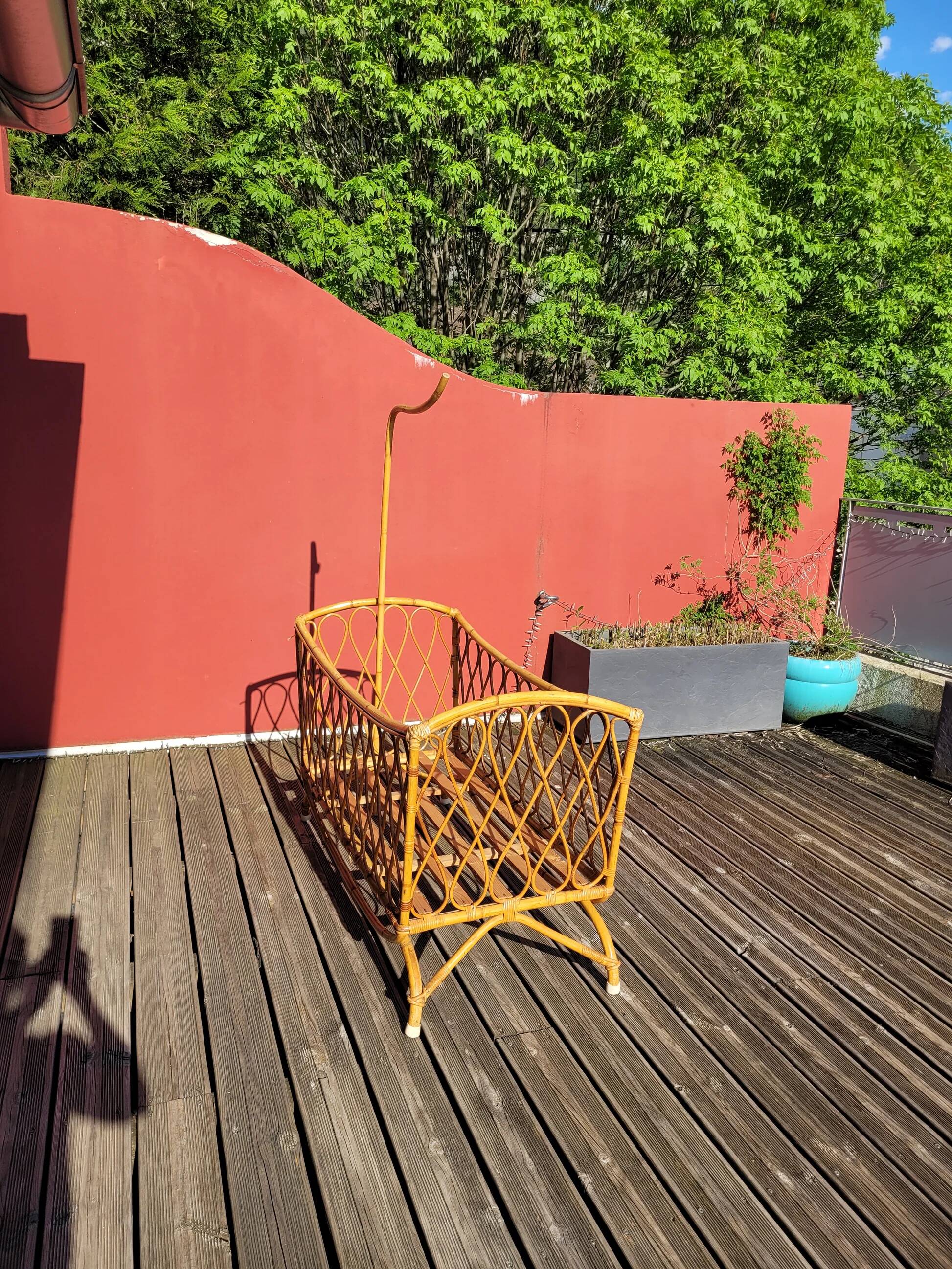 Bamboo and rattan baby cot with canopy.