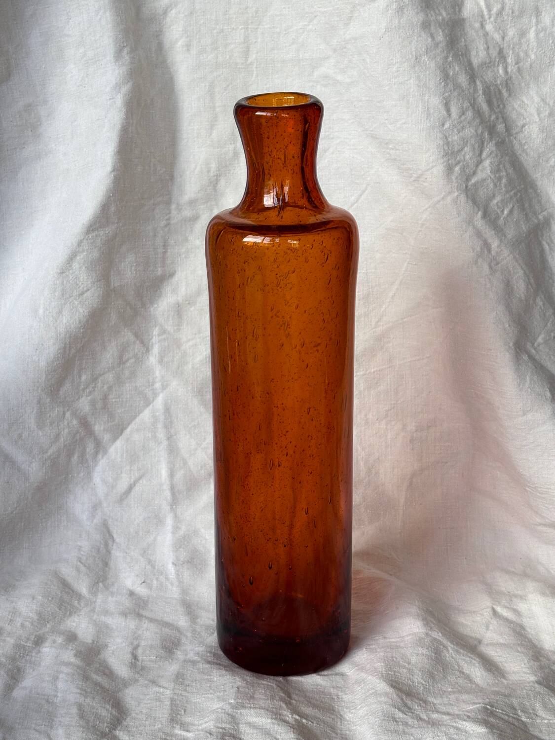 Biot blown glass bottle