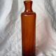 Biot blown glass bottle