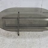 Coffee table with steel base and smoked glass slab. Circa 197