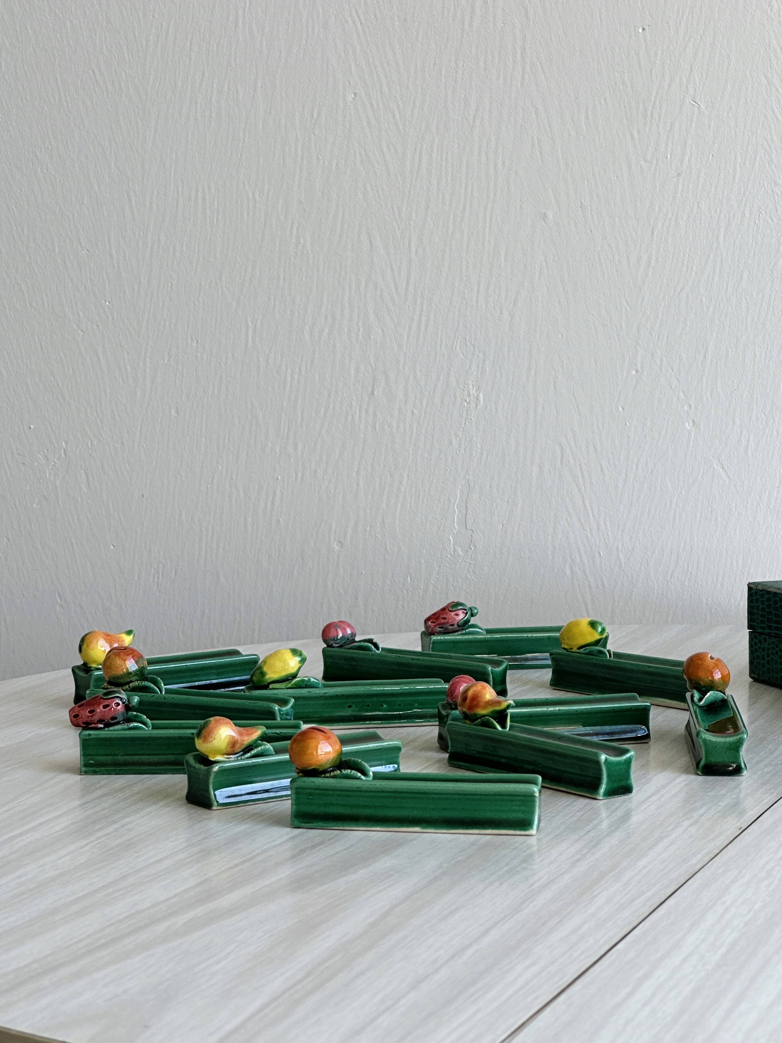 12 ceramic fruit knife holders.