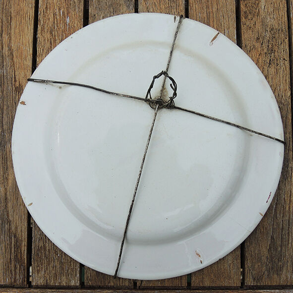 Old faience plate with wall support: blueberry decor