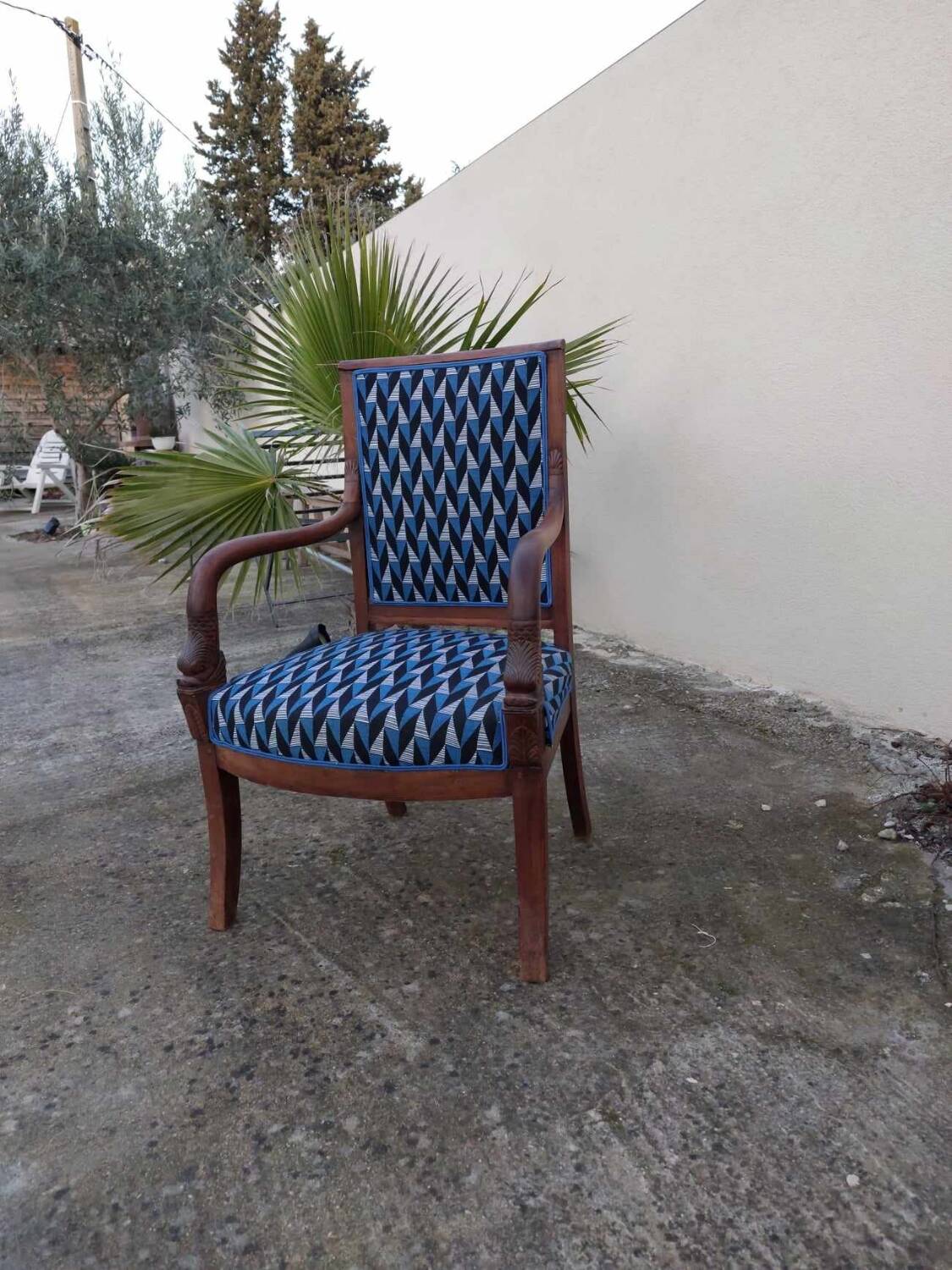 Reupholstered Empire style armchair