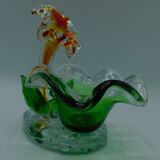Cup has blown glass jewelry