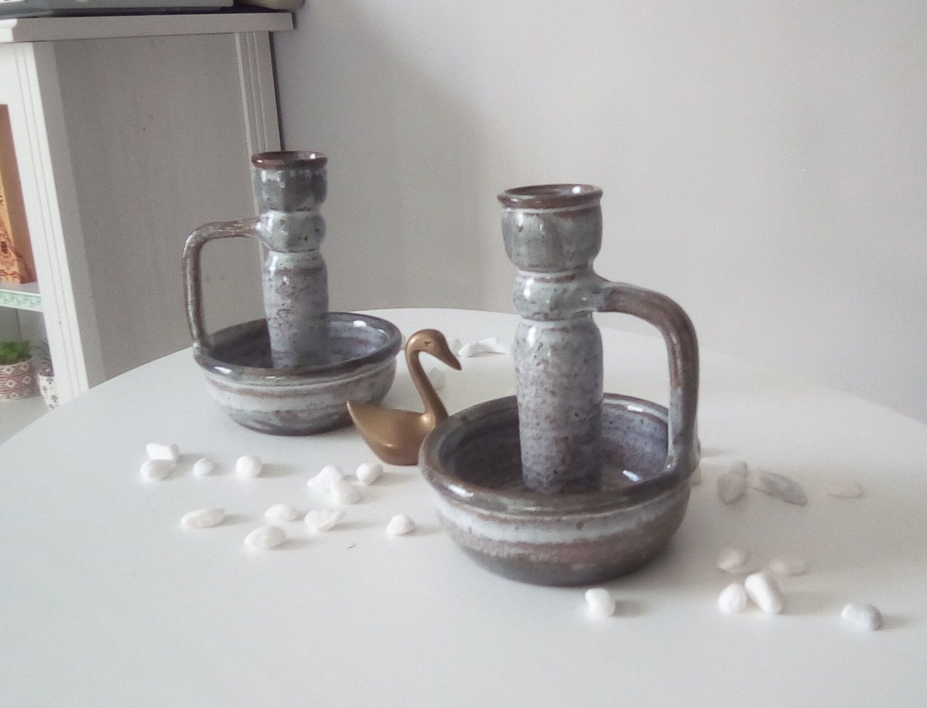 Pair of speckled sandstone candle holders