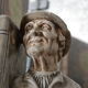 Book-clamps couple of realistic old men in plaster
