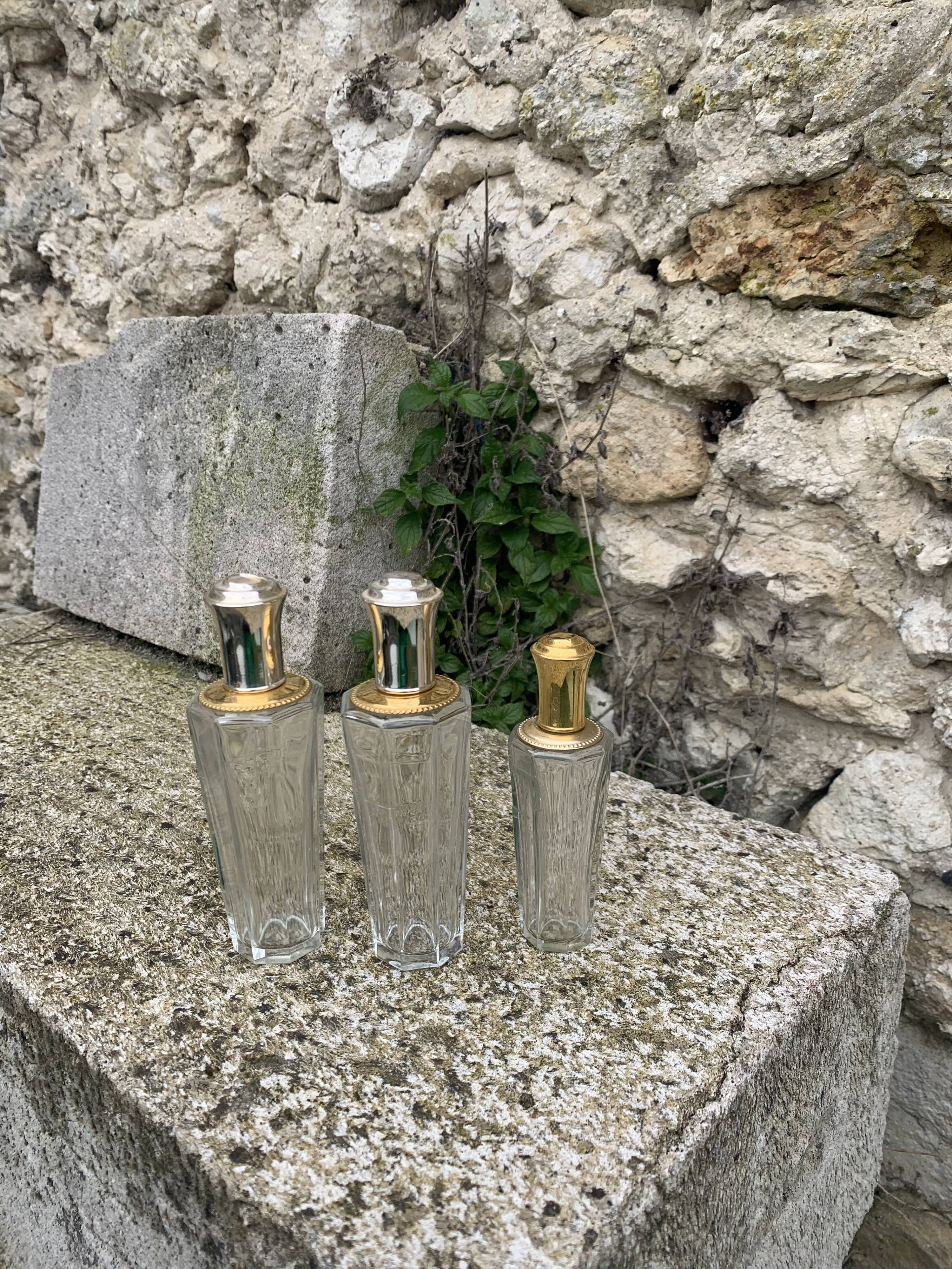Three bottles of crystal perfume signed Marcel Rochas old france
