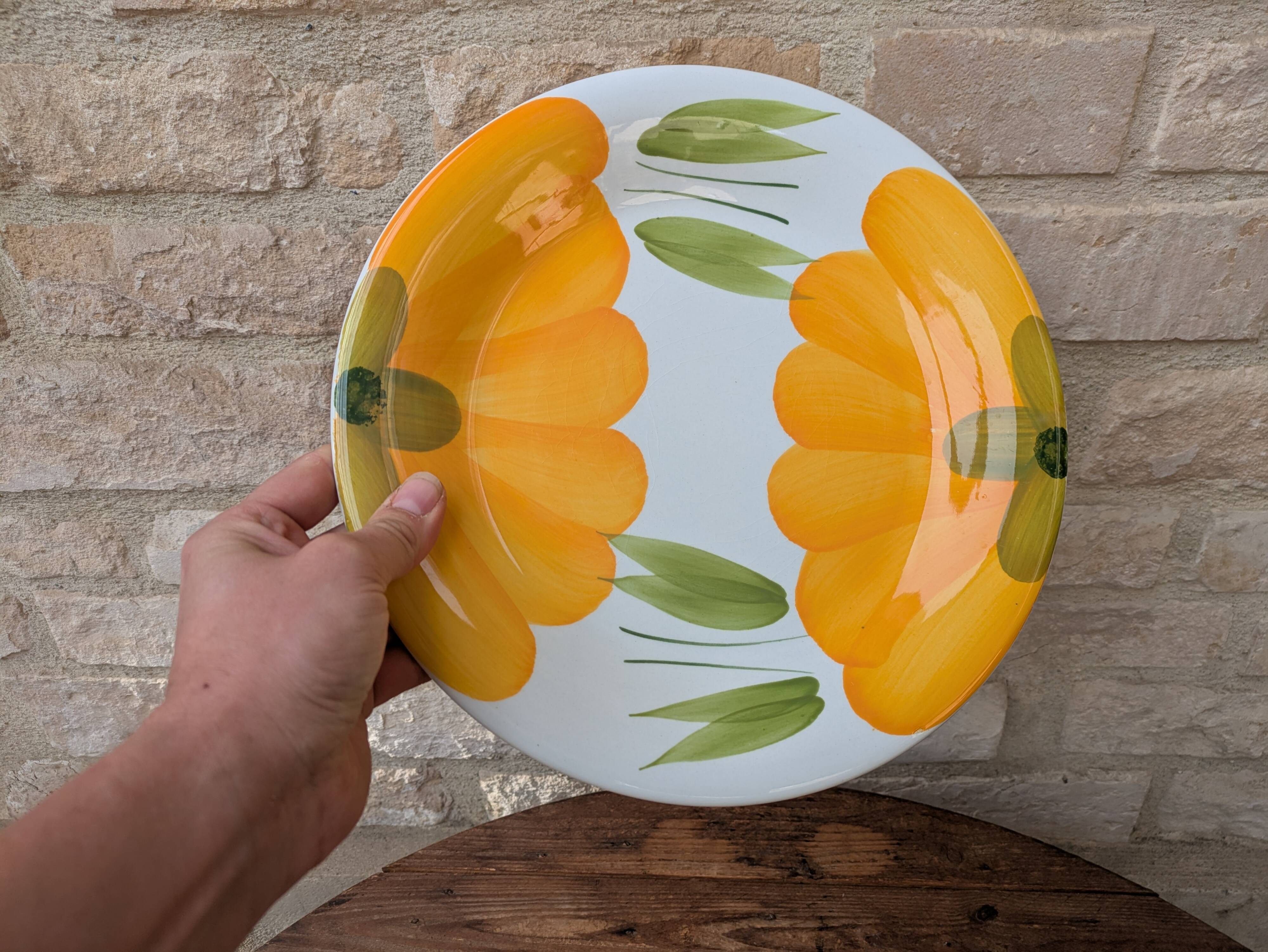 Round serving dish with hand-painted yellow flowers in ceramic TC Italy.