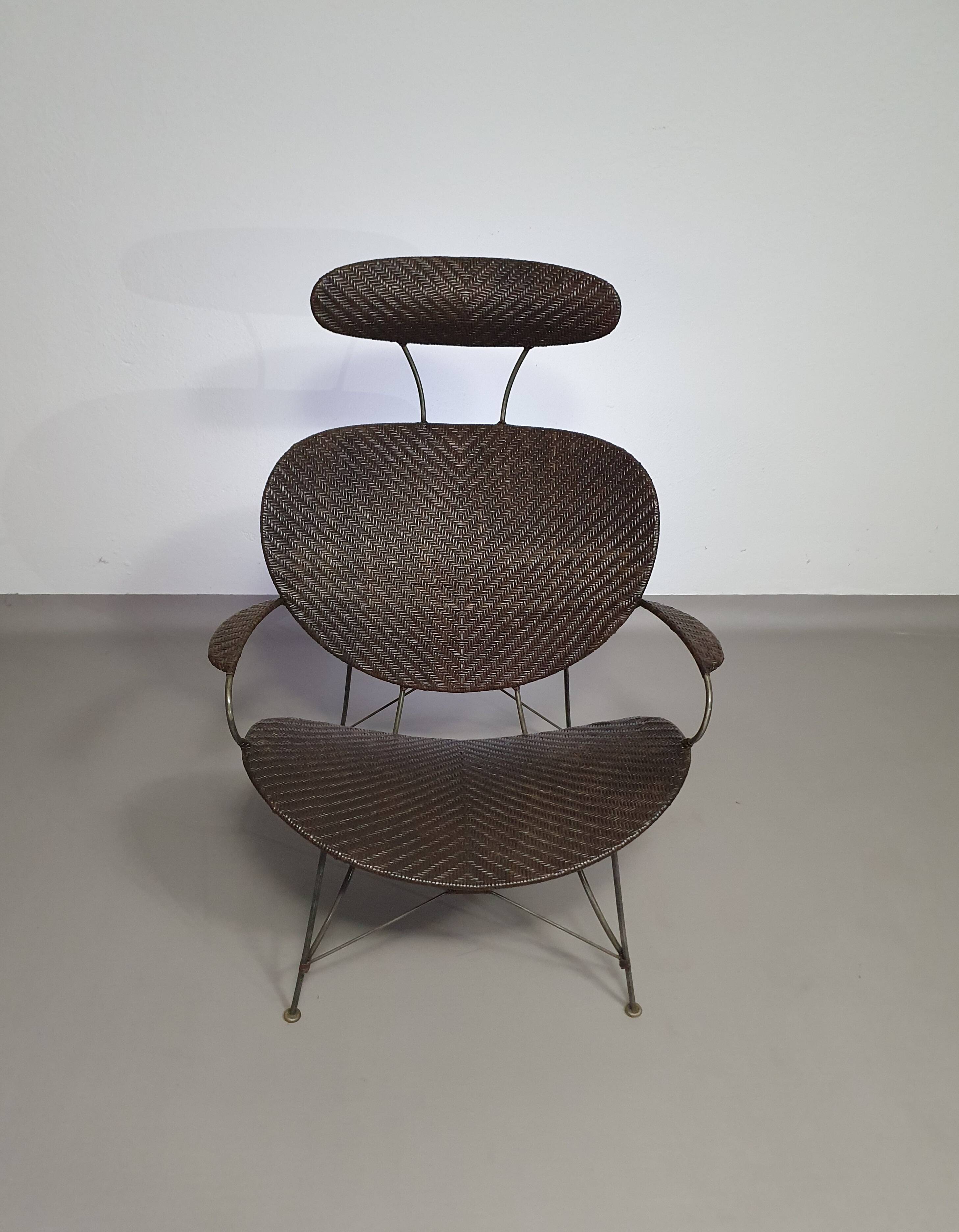 Armchair designed by Yuzuru Yamakawa  Metal frame.  Seat and back in braided rattan.