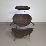 Armchair designed by Yuzuru Yamakawa  Metal frame.  Seat and back in braided rattan.