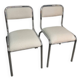 Pair of chrome chairs upholstered in boucle fabric.