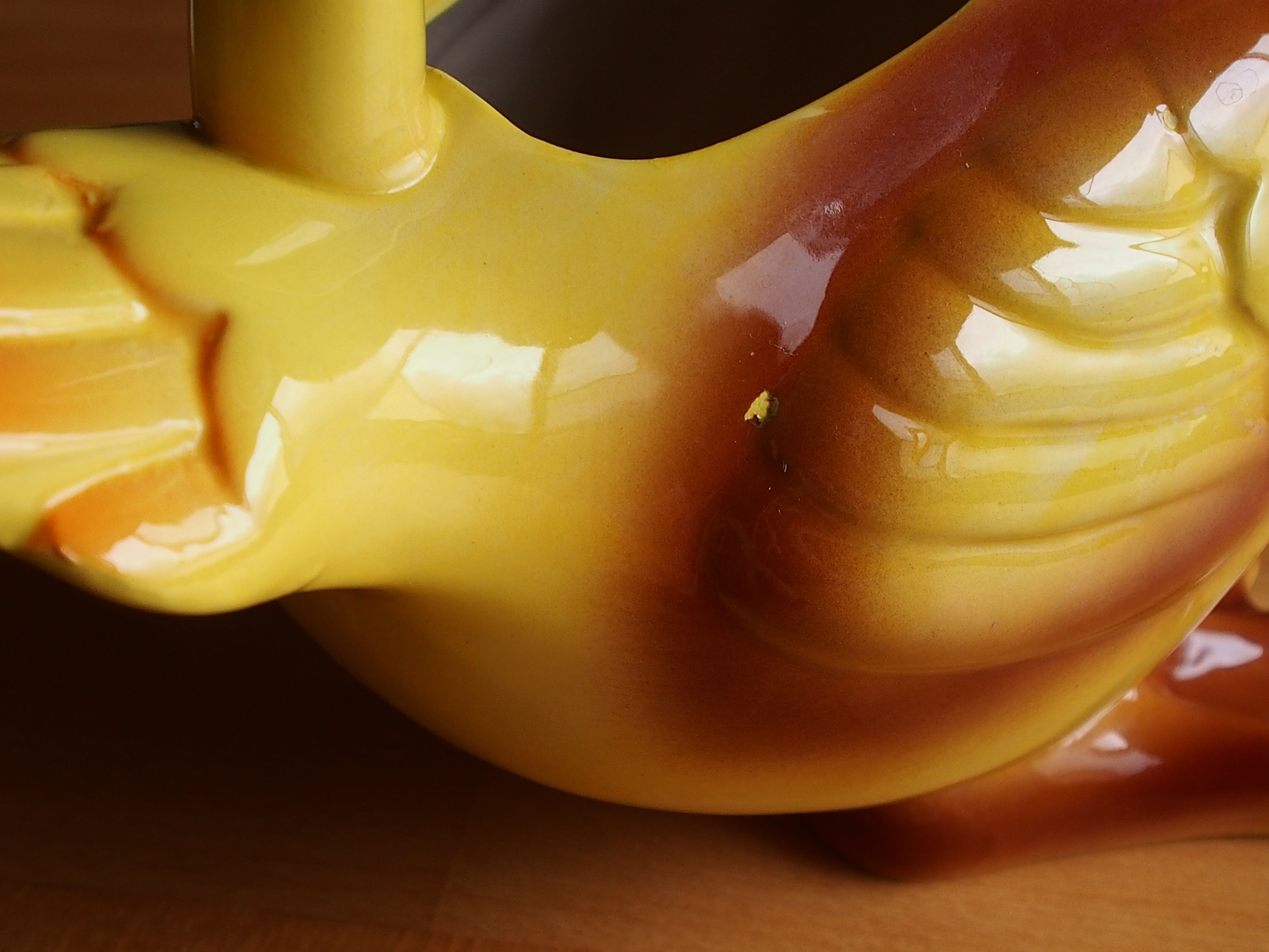 Ceramic watering can in white earthenware, yellow enamel and bird shape