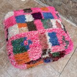 Berber floor pouf: Handwoven Moroccan wool cushion.