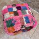 Berber floor pouf: Handwoven Moroccan wool cushion.