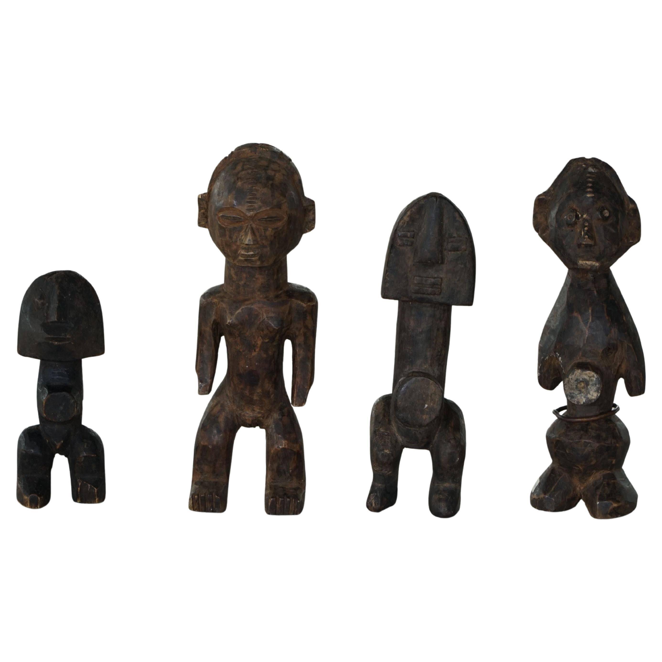 Set of 4 decorative handcrafted African wooden sculptures, mid-century.