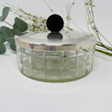 Vintage box made of chiseled glass and covered metal, taken in black Bakelite