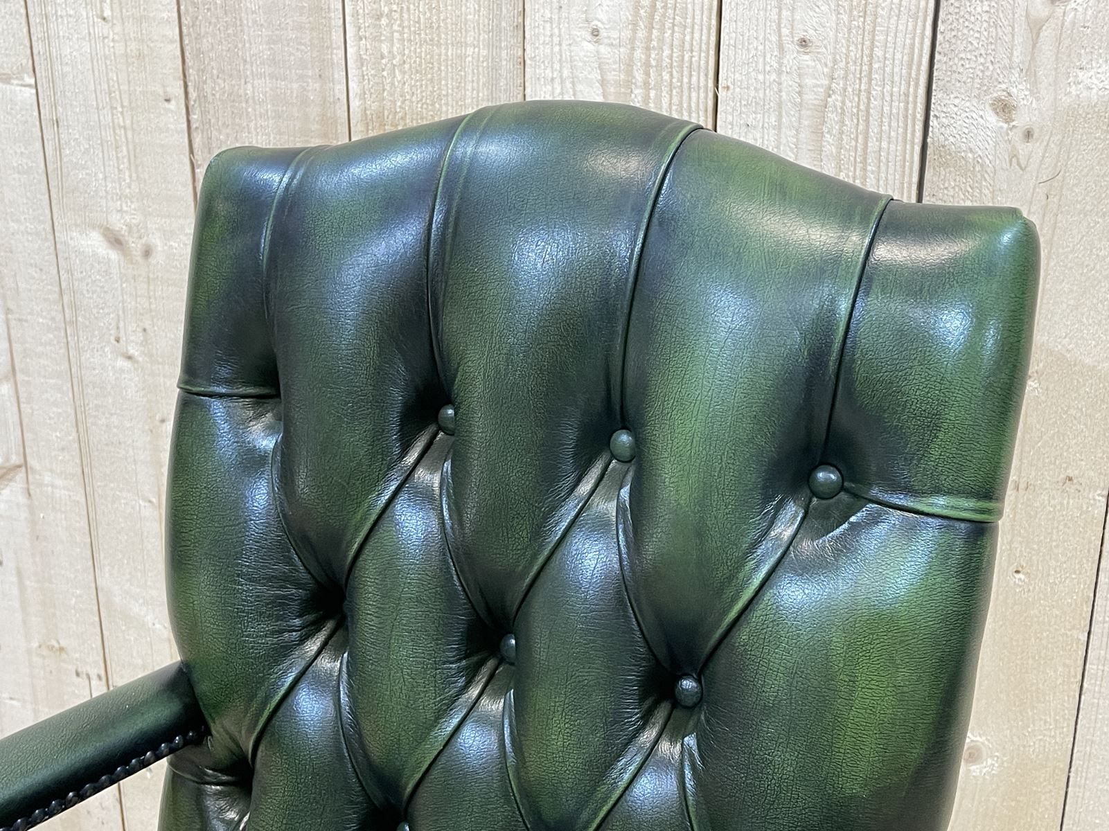 English chesterfield office armchair in green leather from the 1980s