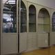 Showcases in lacquered wood, glass and brass  1970s, set of 4