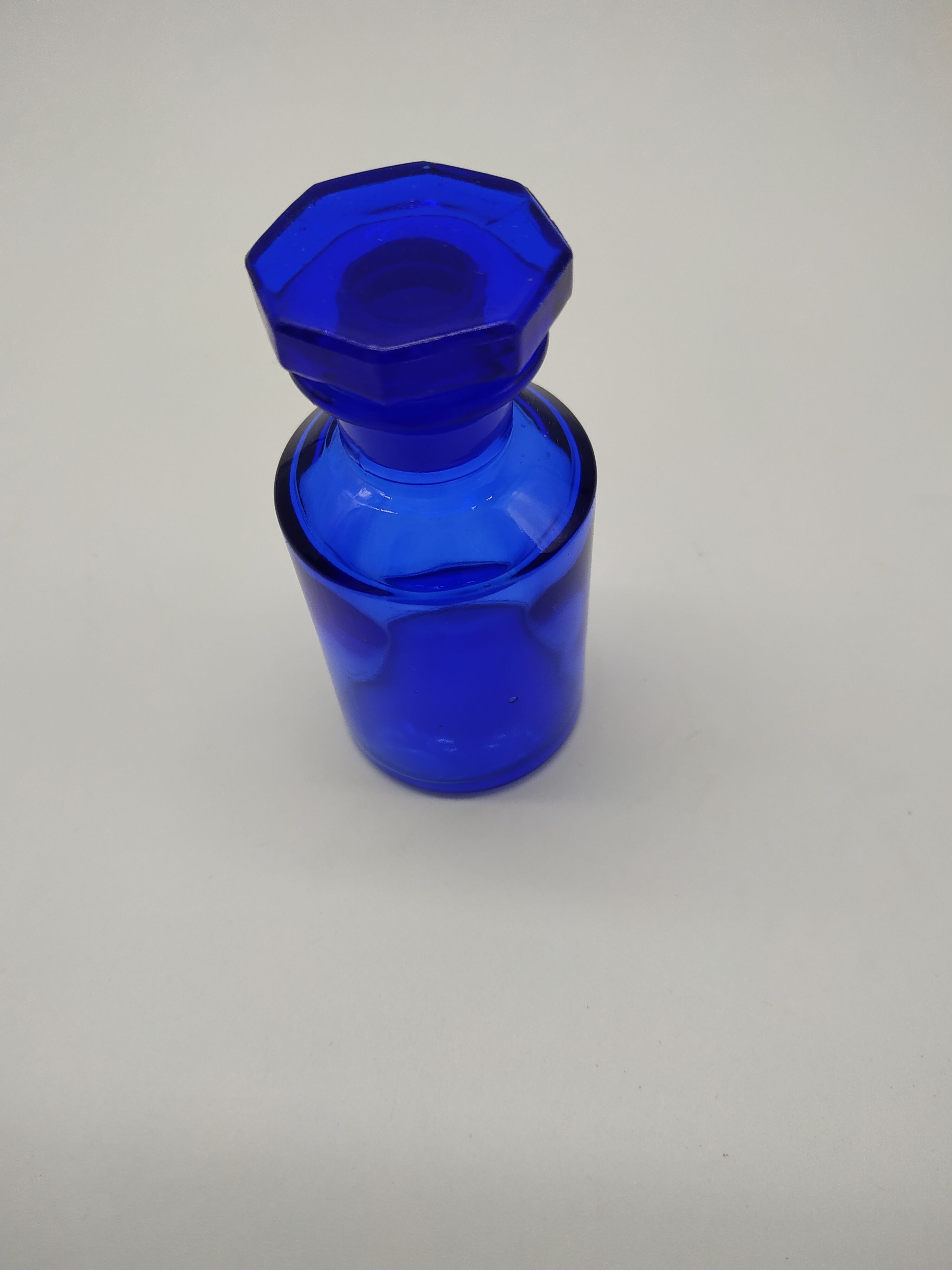 Old perfume bottle in cobalt blue glass