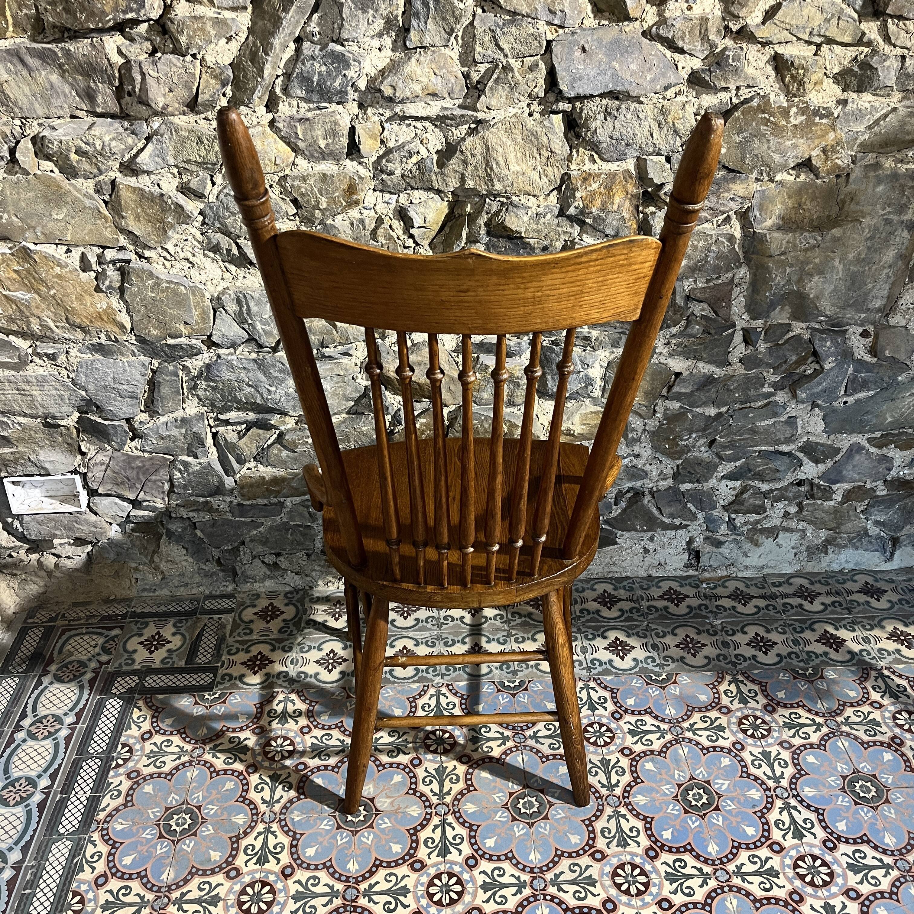 Wooden armchair with high back
