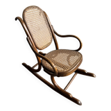 Warm walnut bentwood and cane child's rocking chair early 20th-century